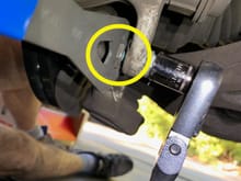 Figure 6: Use a thin 17 mm open-end wrench to keep the caliper pin boot from turning