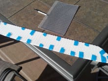 7.  Masking tape used to hold the new grille to the foam as you cut.