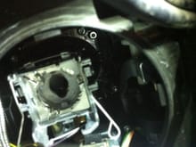 View of the opening for the HID bulb inside the headlamp assembly.