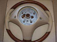 The backside of a 2008 Mercedes SL R230 wooden steering wheel