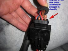 The old existing loom plug in the car is D shaped. The new housing changes the D orientation 180 degrees so that instead of the pump wires on the right of the previous two photos having their wiring backwards... it corrects this one and causes the pump on the left to have its wiring backwards instead.