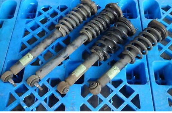 These are sl350 springs and struts. Above the possible different spring rates it appears the lengths and sizes at each end may be wrong, they certainly look different. 