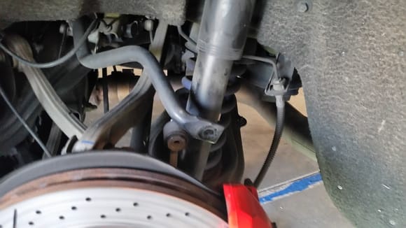 You have to disconnect the sway bar to get to the bolts connecting the rear calipers to the spindle