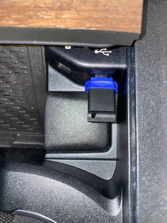 This is what I use, but I usually put it in the center armrest USB-C port.  It records the dash cam and I play songs from it.
