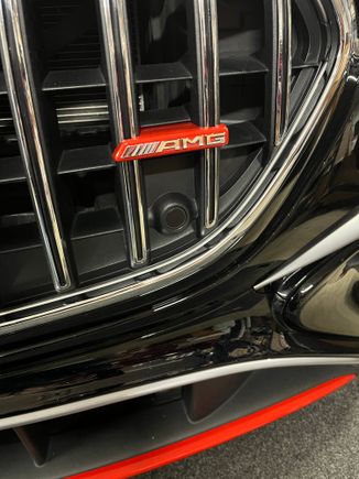 AMG emblem carrier wrapped in metallic red.