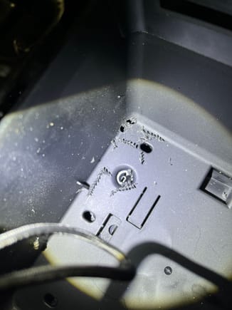 Three 5mm holes in corner of compartment.
