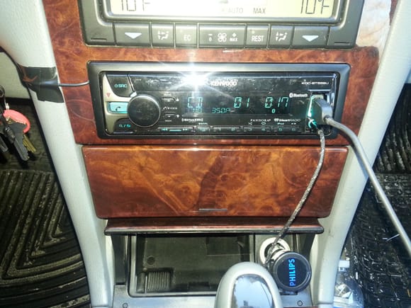 here is the fully installed unit.  Yes, I did not do anything with the microphone cord except TAPE IT TO THE CONSOLE.  Very slightly indeed.  Then again, it is a 14 year old car and I am a klutz.  I might to look at this again in the future, but need the car this week.