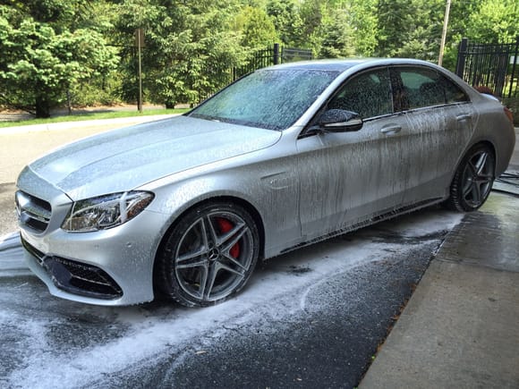 Now for something called a "Foam Bath". I use a foam cannon attached to a power washer. I did two of these on my C63. The first, as pictured, I use a soap called Chemical Guys Citrus Wash. This removes ALL waxes and sealants on the paint. This is essential as part of the prep. Always use a power washer to rinse. Once you rinse the car, you will see a "sheeting" instead of "beading" water. You can rinse the water once all the soap is basically off the car.