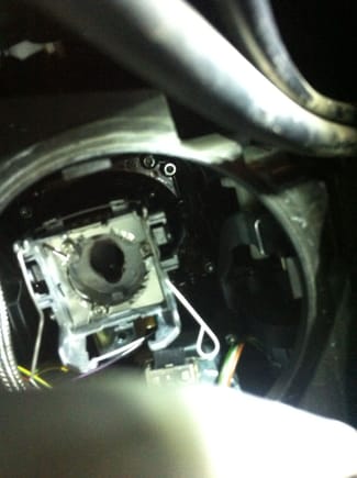 View of the opening for the HID bulb inside the headlamp assembly.