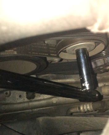 15 mm socket on the tensioner pulley bolt (to release tension turn counter clockwise)