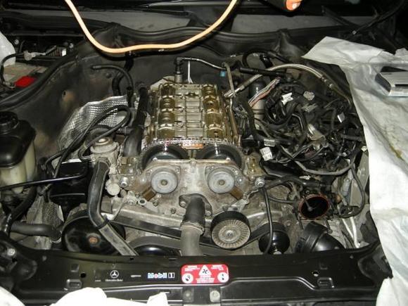 front cam cover and coolant hose reattached