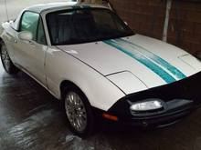 1997 Miata - Base with vintage racing stripes, a 208k mile drivetrain, and rust beyond belief