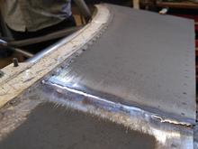 Cue: Downdraft Filter Case. The sheet metal work as literally tacked on to match the styling of the stitch welds that morgan laid on every seam on the car.