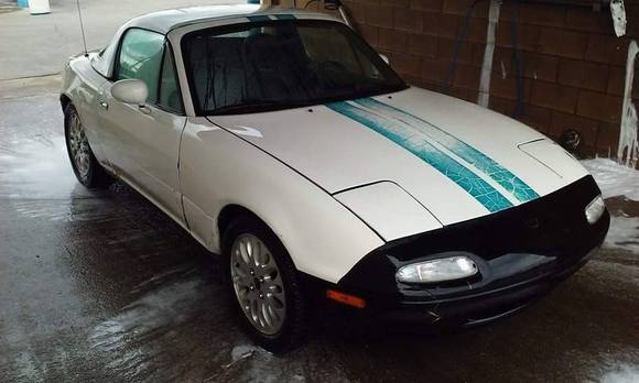 1997 Miata - Base with vintage racing stripes, a 208k mile drivetrain, and rust beyond belief