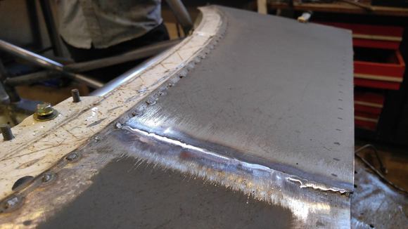 Cue: Downdraft Filter Case. The sheet metal work as literally tacked on to match the styling of the stitch welds that morgan laid on every seam on the car.