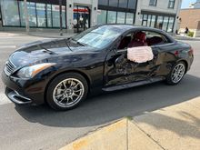 This G was not hit very hard, but was hard enough to deploy three airbags and the drivers seat belt safety.  The inside of the driver's door has reusable maple trim and red leather panels.