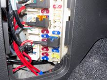 Drive’s side fuse box connections (mentioned earlier in the thread). Note that the ground you want to use is just below the fuse box. You will need a crimped terminal connection on the ground. Loosen the 10mm bolt, slip the connection on then tighten. 