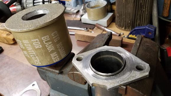 The rear split path flange surfaces to the muffler were pitted kind of bad.  I used a howitzer blank casing to make this sanding grinder to drive with a drill slowly to improve the surface for the gaskets, the muffler side was not as bad.