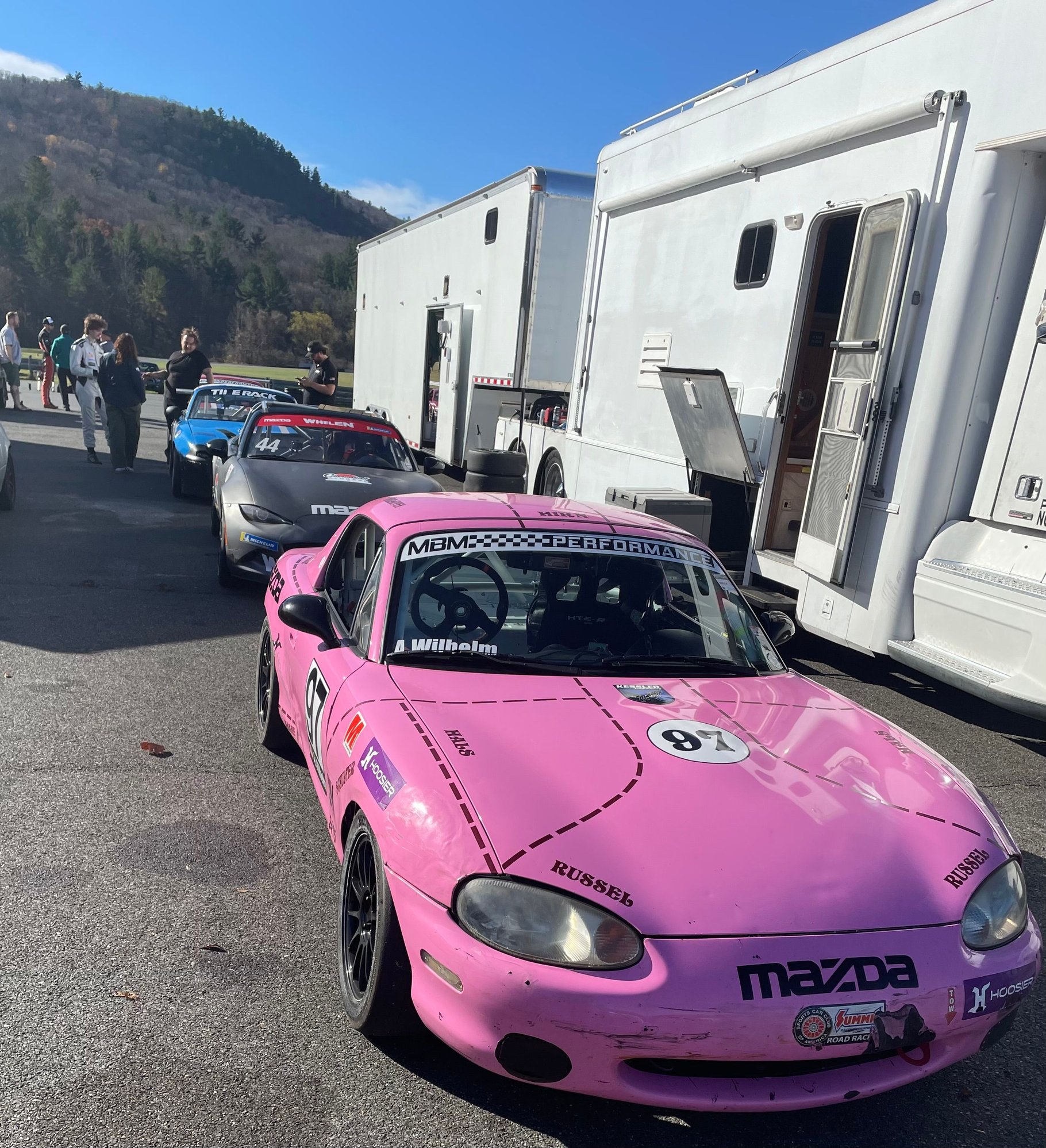 A bevy of spec Miatas - this pink one was in the tires