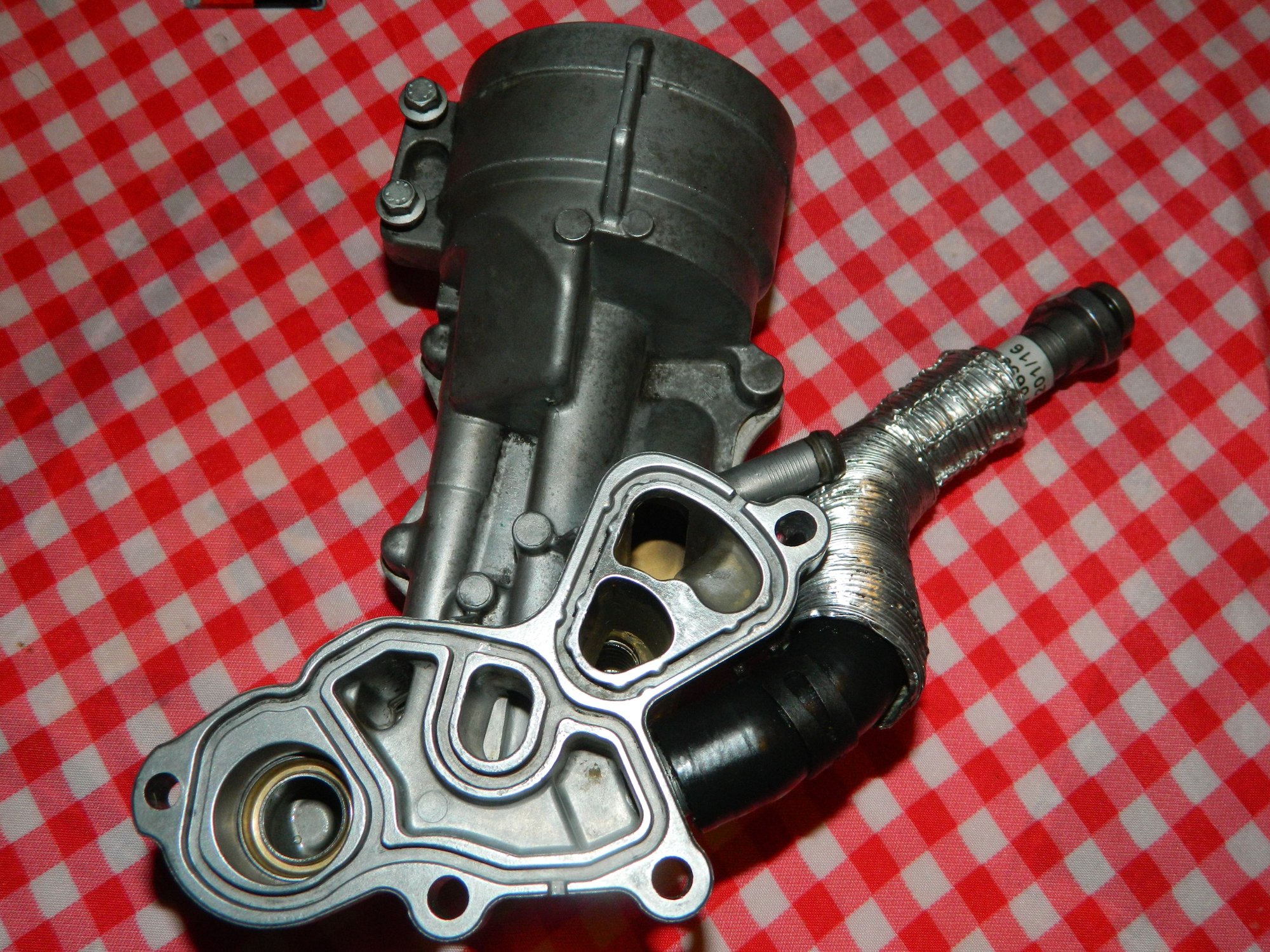 How To Oil cooler/filter housing gasket replacement Page 10 North