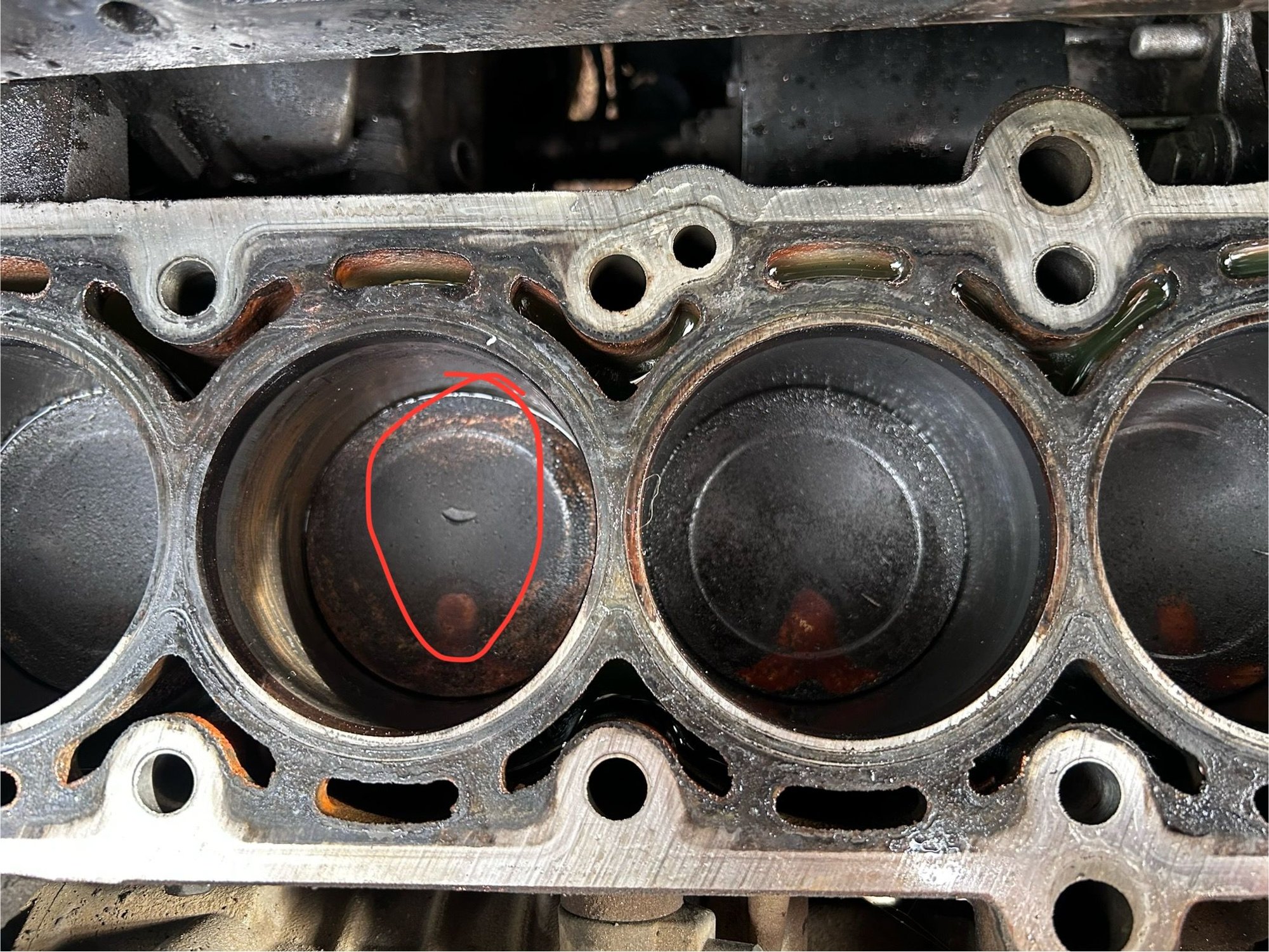 Piston #2 dented by a valve 