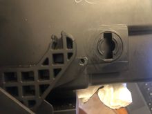 The keyed point on the glovebox where the damper goes.