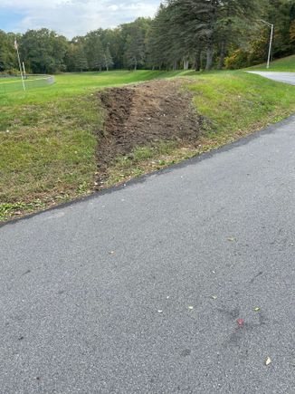 That is 6 to 10 inches deep where the car gouged into the hillside