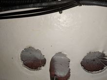 Inside engine compartment looking up directly below opening under sun pad.