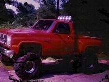 JD My 1985 GMC sierra Stepside  350v8 Granny low 4 speed, Double tube roll bar 5 KC daylighters, brush guard, 40's 16&quot; total lift. This was one mean truck