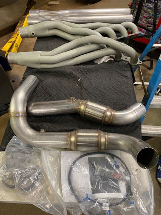 Headers arrived after 13 weeks. Jet Hot 2000 off-road gray coated Stainless Works 1-7/8 x3" headers with GESI converters and x pipe.