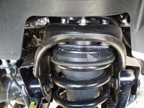 spacer on top of coil spring