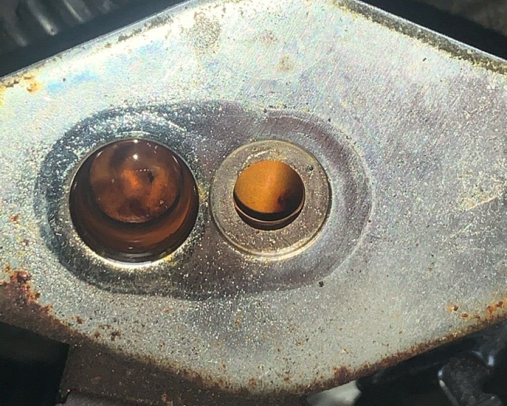 this is what is underneath the fuel regulator looks like some rust or something is in the lines but i wasnt able to clear it. Maybe something clogging the lines??