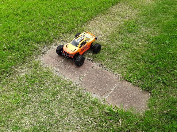 AE MT10X on the starting pad 'brickyard' back yard grass track tri-oval