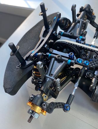 Flipping the arms allows you to use the brass weights in the deeper recess and also the x braces. Using 3x20 set screws and spacer and nut helps keep shims in place when changing.