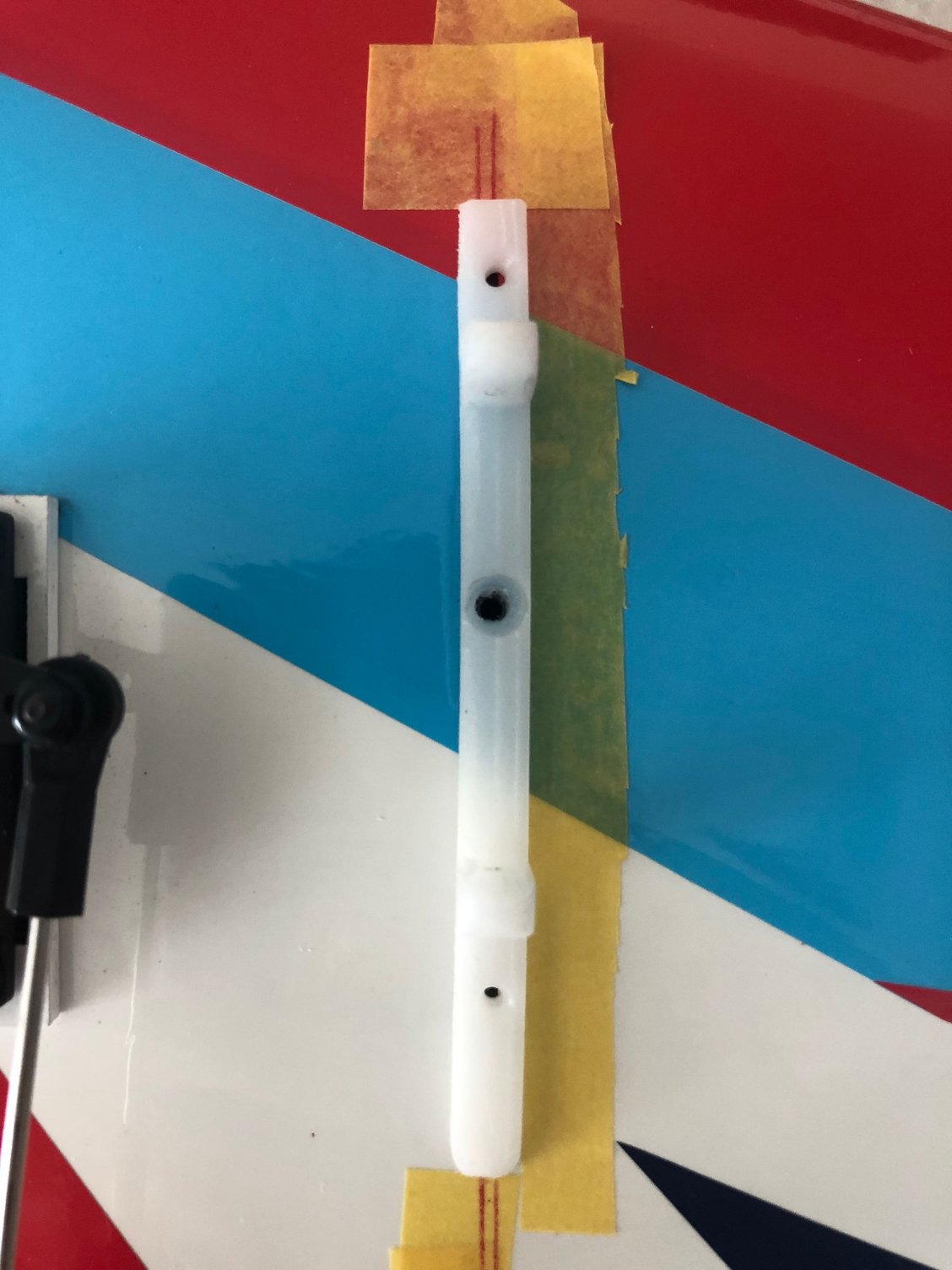 The Hobby Flight part is screw in the wing with the two 2 mm screws coming with the parts, plus a 3 mm screw using the factory drilled hole    as well as perfect location of the strut