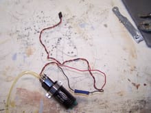 the pump solenoid had a very long lead with a squeeze connector. I light tug pulled the wire out. So I trimmed it down for a neater soldered install