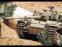 Firing from the "hull down" position. This makes the tank very hard to hit in both real world and IR battling. The Shot Kal conversion does it well, but not quite as well as the original Tamiya turret. 