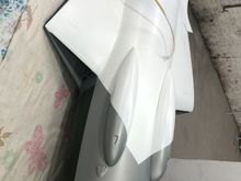 painting the white background  to apply the Swiss Cross red