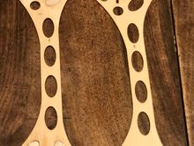 Adjacent plywood holes are filled with balsa