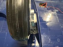 Here you see the rather extreme angle of the doors to the strut/tire.  This is built into the design and can't be helped.  The aluminum wedge securing the bottom of the strut to the door angles both side to side and top to bottom!  Was a fun bit of machining.
