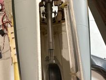 Notice two small holes in fuse near relief to allow use of a ball driver to secure rear of retract.