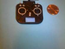 Compare the size of the transmitter to the new penny laying beside it.