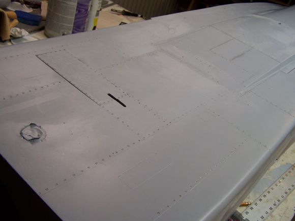 some rivets and panel lines on the top rear of the fuse. they will all need to be subdued with some steel wool of light sanding