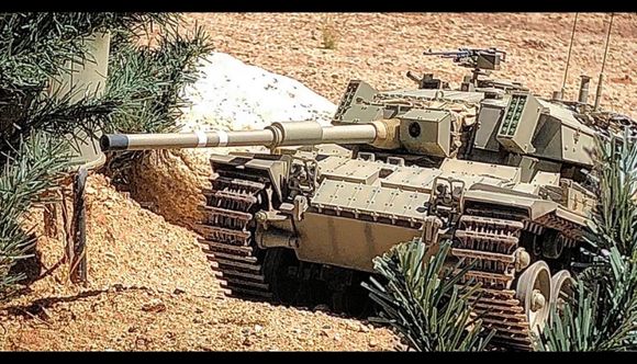 Firing from the "hull down" position. This makes the tank very hard to hit in both real world and IR battling. The Shot Kal conversion does it well, but not quite as well as the original Tamiya turret. 