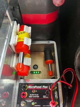 The 12 volt 12 AH battery in my flight box is a very lightweight, Lithium Ion motorcycle battery. It has a push button on top to activate an LED bar graph State Of Charge display. I added a few holes to the cover so I could make use of that feature.   The battery is kept topped off by connecting the power panel to the Powerpole system.