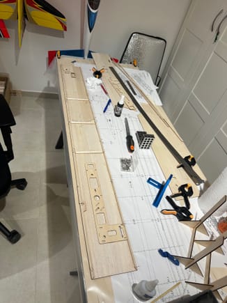 Using wood glue and CA, glueing the fuselage sides and frame, using wood glue and CA.