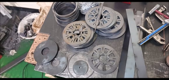 Laser machining parts for fabricating bogie wheels