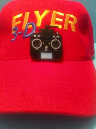 Small transmitter you can wear on your hat held on tightly by a very strong magnet.  No holes in your HAT!