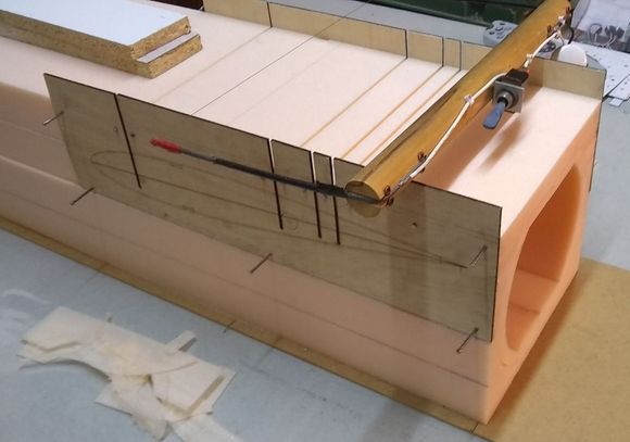 Four accurate slots cut for formers. The root rib shape is etched on the plywood guides.