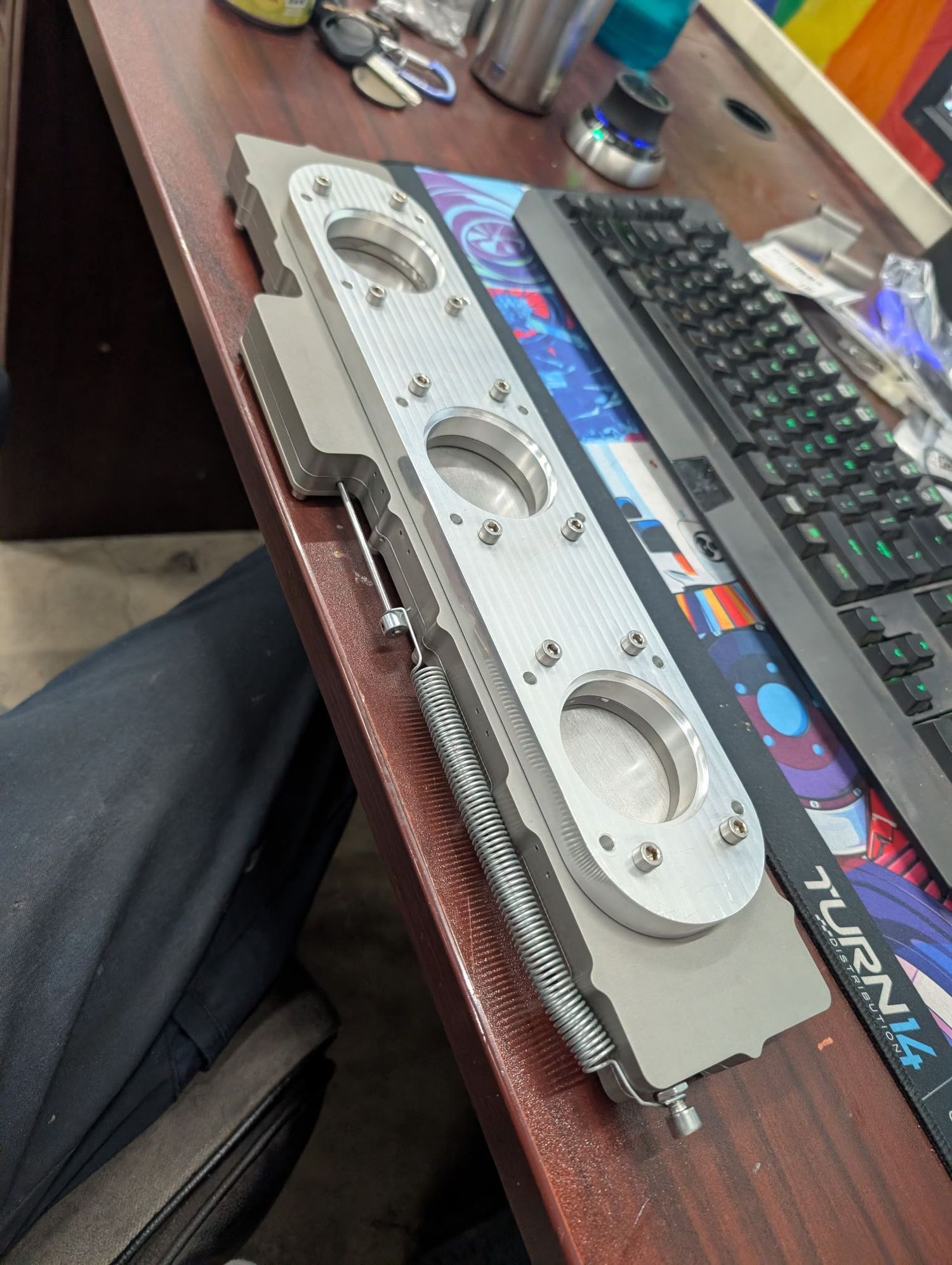 The bottom- included is a flange to weld the intake runners to.